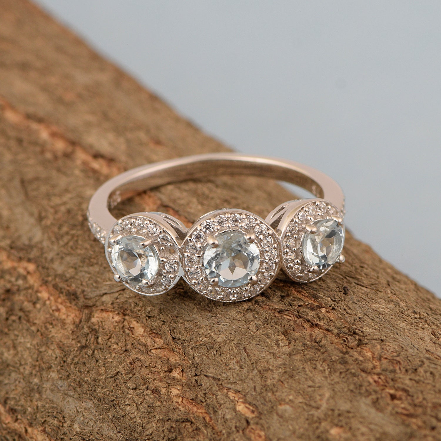Swiss Blue Topaz 3-Stone Halo Ring - Sterling Silver
